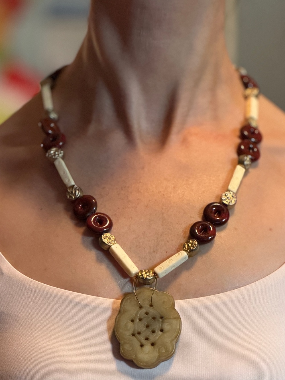Handcrafted Burgundy and Cream Beaded Necklace with carver stone Pendant.